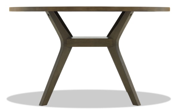 Round wooden dining table with dark brown finish, angled legs, and a sturdy crossbar support, suitable for modern or rustic interiors.