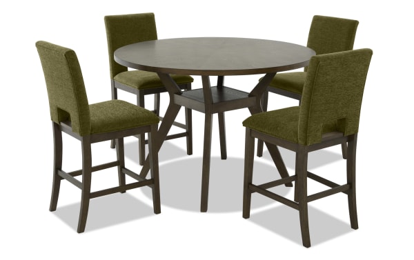 Round wooden dining table set with dark brown finish and four olive green upholstered chairs featuring cushioned seats and backs.