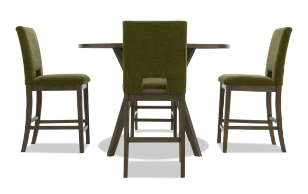 Dining set with a round wooden table and four olive green upholstered chairs featuring dark wood legs and footrests, modern style.