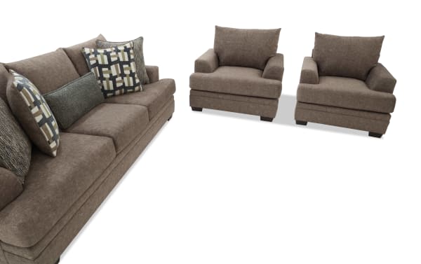 Brown fabric living room set with a three-seater sofa and two matching armchairs, featuring plush cushions and patterned throw pillows.