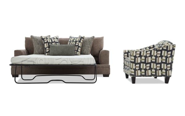 Brown fabric sofa with a pull-out metal frame bed and patterned cushions, paired with a matching geometric-patterned armchair with wooden legs.
