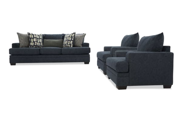 Dark blue fabric living room set featuring a three-seat sofa with patterned and solid throw pillows, and two matching armchairs with plush cushions and wooden legs.