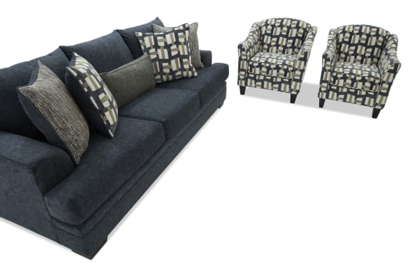 Dark gray fabric sofa with multiple patterned throw pillows paired with two matching geometric-patterned armchairs, modern living room set.