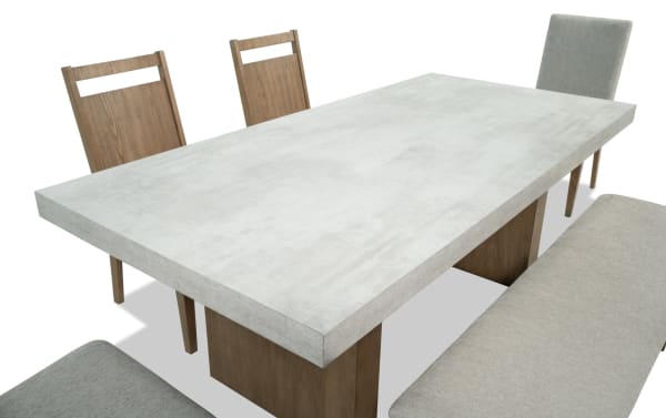 Monterey 6 Piece Natural & Gray Upholstered Dining Set with bench, featuring a faux concrete melamine tabletop, gray polyester fabric chairs, and natural wood frame in traditional style.