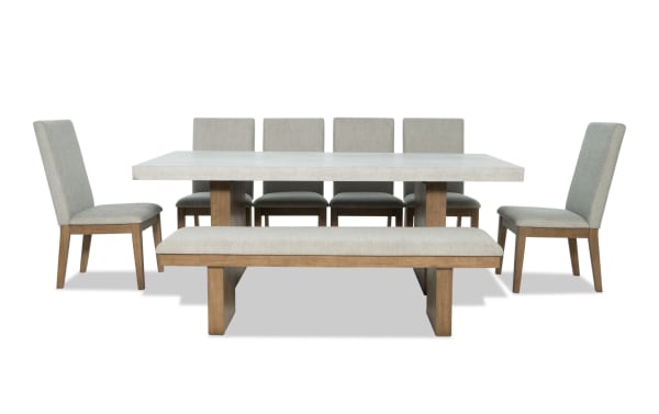 Monterey 8 Piece Natural & Gray Solid Back Upholstered Dining Set with Bench, traditional style with gray polyester fabric, faux concrete melamine tabletop, MDF and hardwood solids, includes six memory foam chairs and matching bench.
