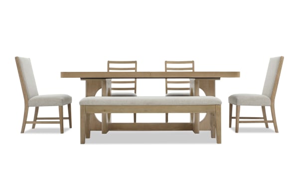 Dining set with light wood finish featuring a rectangular table, two ladder-back chairs, two upholstered side chairs, and a cushioned bench.