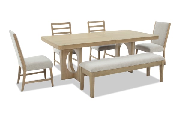 Dining set with a light wood rectangular table featuring oval cut-out legs, two ladder-back chairs, two upholstered beige side chairs, and a matching cushioned bench.