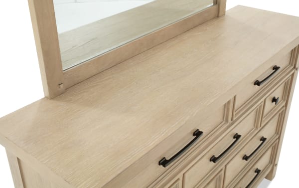 Hudson Natural 9 Drawer Dresser & Mirror in distressed light wood finish with black metal handles, part of Hudson Bedroom collection. Transitional style with rubberwood, pine, MDF, mango veneer, and plywood materials. Features felt-lined top drawers and rustic design for stylish storage.