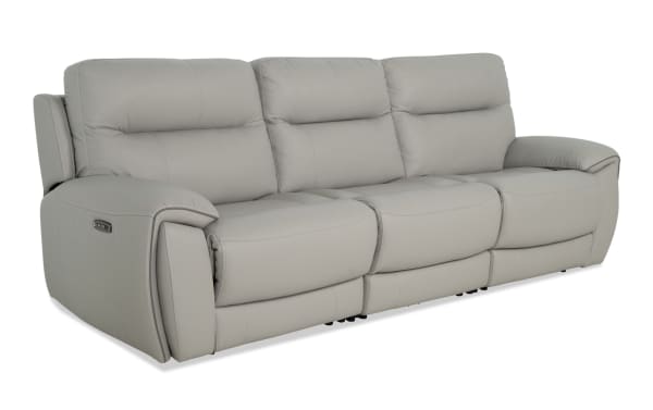 Illusion Gray Leather 107'' power reclining sofa in gray leather with plush cushions, power headrests, and USB ports, featuring transitional style and memory foam comfort.