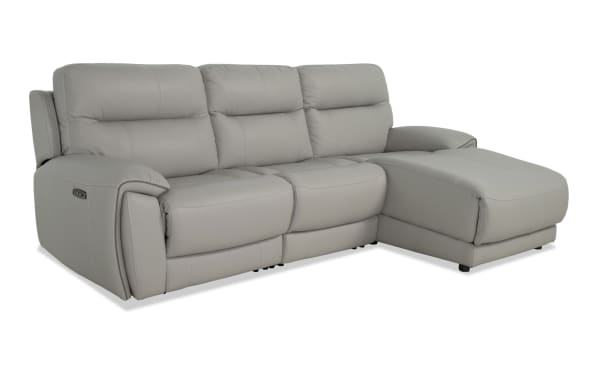 Illusion Gray Leather 110'' power reclining sectional with right arm chaise, armless power recliner, power headrest, and gray transitional leather upholstery.