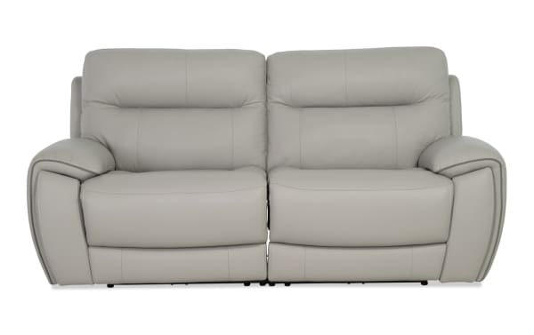 Illusion Gray Leather 78'' Power Reclining Loveseat with power headrests, USB ports, cup holders, and Bob-O-Pedic® Memory Foam cushions in transitional gray leather upholstery.