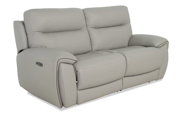 Illusion Gray Leather 78'' power reclining loveseat with power headrest, gray transitional style, 100% leather upholstery, memory foam cushions, USB ports, and cup holders.