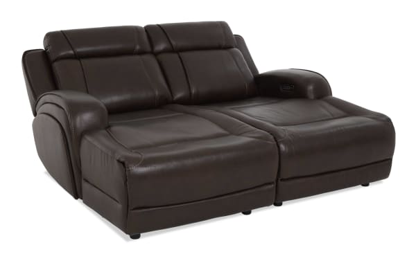 Dark brown leather reclining loveseat with plush cushioning, padded armrests, and visible control buttons for adjustable comfort.