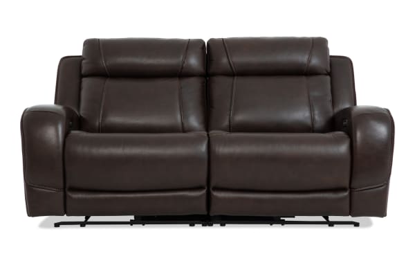 Tracker Brown Leather 79'' Power Reclining Loveseat with Power Headrest, contemporary brown leather upholstery, plush memory foam cushions, USB ports, and built-in storage.