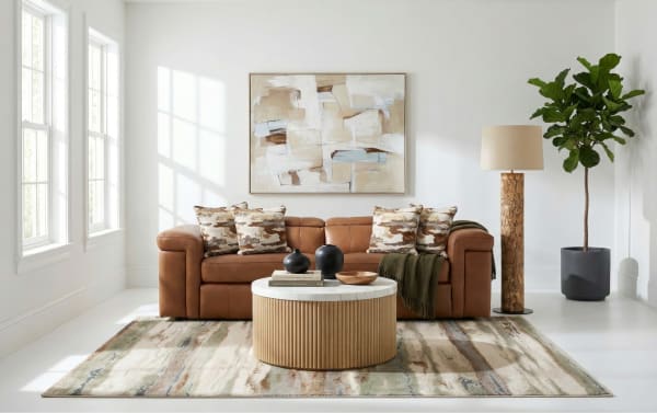 Contemporary Cannon Cognac Leather 98" power reclining loveseat with power headrest, plush Bob-O-Pedic® memory foam cushions, and accent pillows.