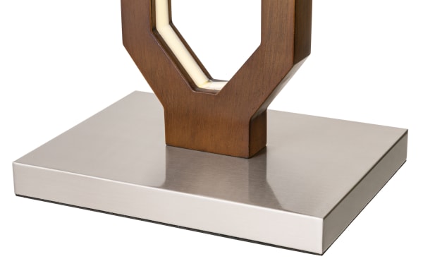 Rectangular brushed stainless steel base supporting a wooden lamp stand with integrated LED lighting, showcasing modern design and mixed materials.