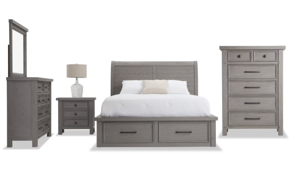 Hudson 5 Piece Full Gray Storage Platform Bedroom Set in transitional style with rubberwood, pine, MDF, mango veneers, and pewter hardware. Features a paneled sleigh bed with six storage drawers, matching dresser with mirror, chest of drawers, and nightstand, all in a gray finish with character-enhancing wood grain.