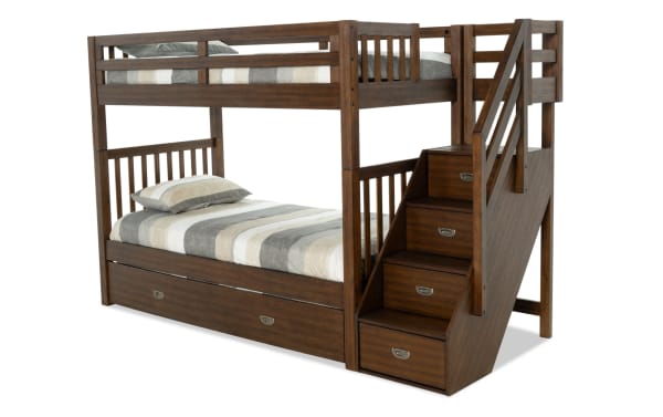 Chadwick Twin/Twin brown stairway bunk bed with twin trundle, transitional style, solid pine wood, built-in storage stairs, and versatile trundle for sleepovers or storage.