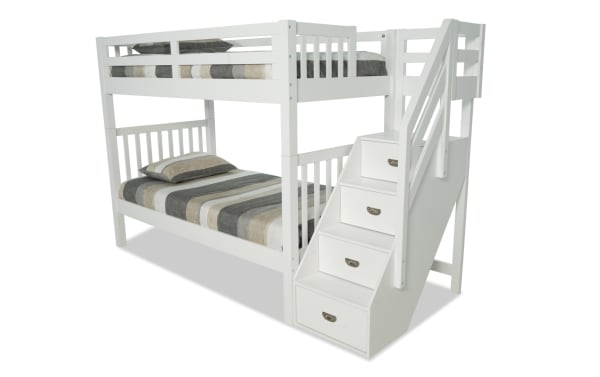 Chadwick Twin/Twin white stairway bunk bed with solid pine construction, transitional style, built-in storage drawers in stairs, and two striped mattresses.
