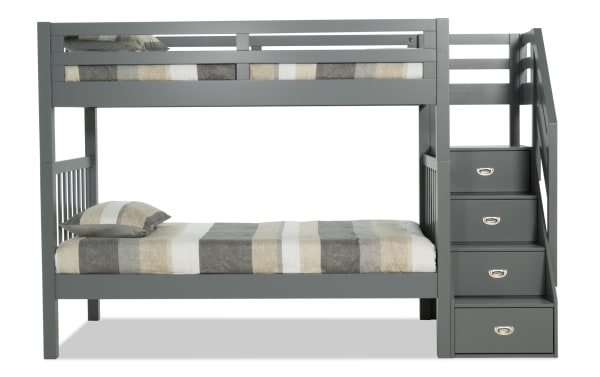 Chadwick Twin/Twin gray stairway bunk bed with solid pine construction, transitional style, built-in storage stairs, and two striped Perfection innerspring mattresses.