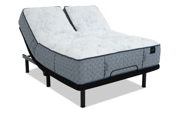 Adjustable split queen mattress with blue textured fabric sides and white quilted top, designed for customizable comfort and support.