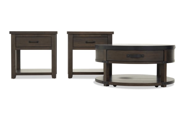 Set of dark brown wooden furniture including two square end tables and one round coffee table, featuring metal handles and lower shelves, rustic style.