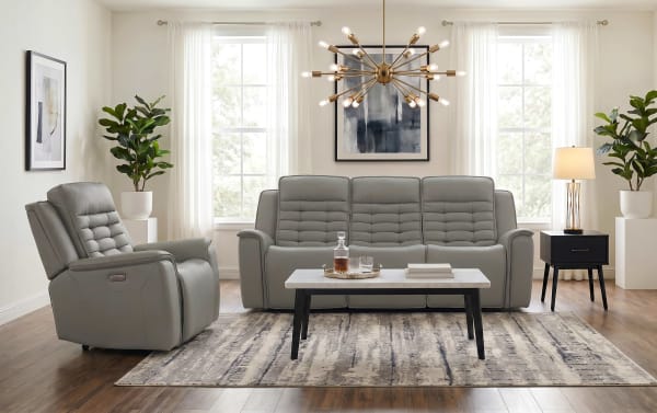 Contemporary Raptor Gray Leather 87'' power reclining sofa and recliner set with gray leather upholstery, power headrest, lumbar support, and USB charging ports in a bright living room.