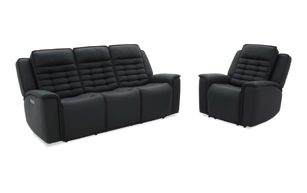Black leather reclining sofa and armchair set with padded, segmented backrests and cushioned armrests, designed for modern living rooms.