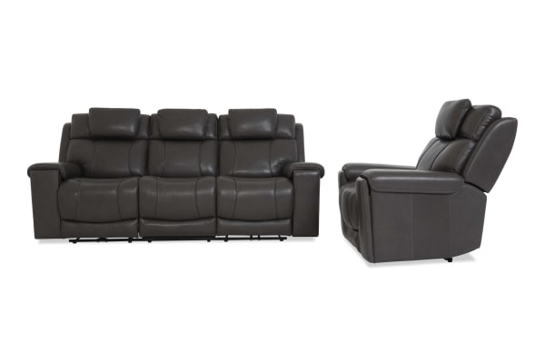 Dark gray leather reclining sofa set with three seats, padded headrests, and cushioned armrests, shown from front and side angles.