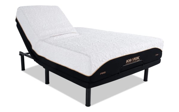Adjustable bed base with black metal frame and white textured mattress labeled "BOB OPEDIC Copper Sport Plush Firm," showcasing ergonomic incline feature for comfort.