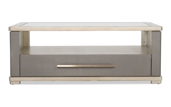 Rectangular modern coffee table with a glass top, metallic frame, gray textured drawer, and a long horizontal metal handle for storage.