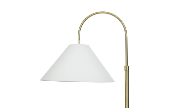 Floor lamp with a white conical fabric lampshade and a curved brass metal arm, ideal for modern home or office lighting.