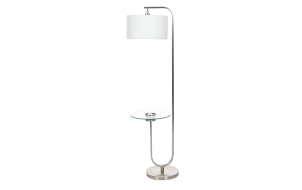 Modern floor lamp with brushed nickel finish, white drum shade, and built-in round glass side table, ideal for living room lighting and decor.
