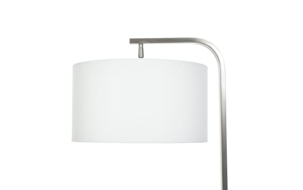 Modern floor lamp with a brushed metal curved arm and a large white fabric drum lampshade, suitable for living room or office lighting.