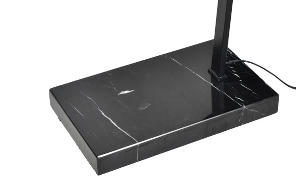 Black marble rectangular base of the Deacon 79'' Black LED Arc Floor Lamp with steel construction and transitional style, supporting the lamp’s arc arm.