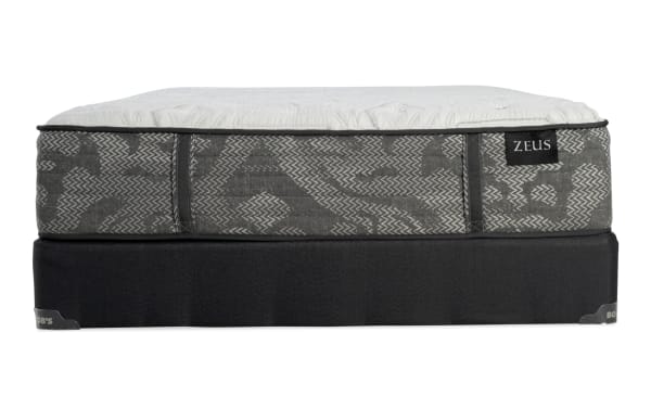 Zeus mattress with gray patterned fabric sides, white quilted top, and black base, designed for comfort and support.