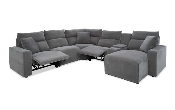 Modern gray fabric sectional sofa with reclining seats, plush cushions, and chaise lounge, designed for comfort and contemporary living rooms.