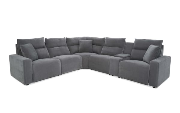 Modern gray fabric sectional sofa with plush cushions, corner design, and wide armrests, ideal for spacious living rooms and contemporary decor.