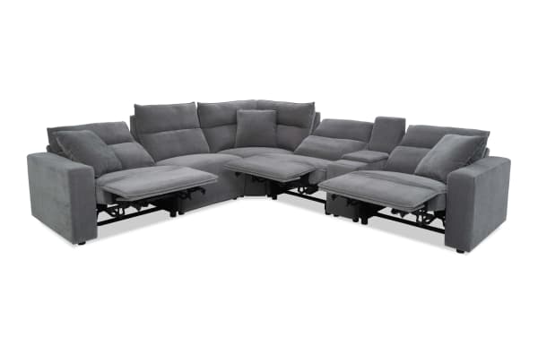 Gray fabric sectional sofa with reclining seats, adjustable headrests, and plush cushions, designed for modern living rooms.