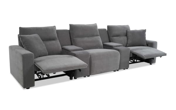 Modern gray fabric reclining sectional sofa with plush cushions, wide armrests, and built-in footrests for enhanced comfort and relaxation.