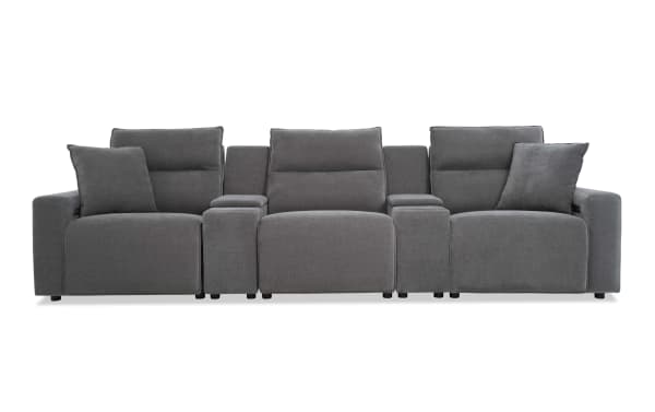 Modern gray fabric three-seat reclining sofa with padded armrests, adjustable headrests, and two matching throw pillows, ideal for living room comfort.