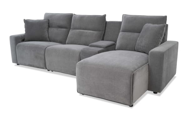 Modern gray fabric sectional sofa with chaise lounge, plush cushions, padded armrests, and built-in recliner controls for living room comfort.