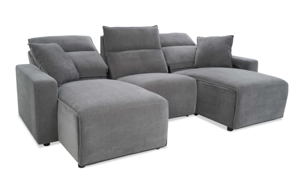 Modern gray fabric sectional sofa with adjustable reclining backrests, plush cushions, and wide armrests, designed for living room comfort.