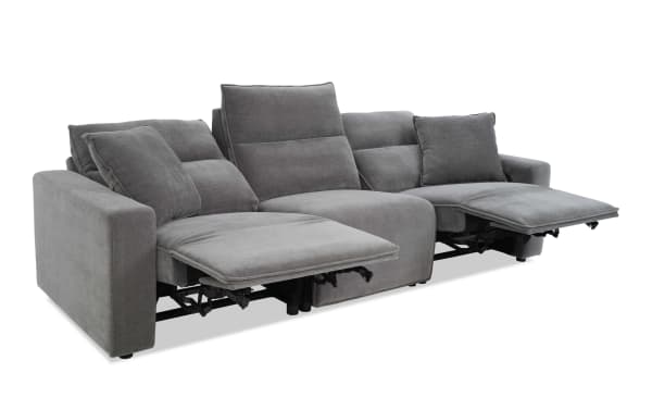 Modern gray fabric reclining sectional sofa with adjustable footrests, plush cushions, and wide armrests, ideal for living room comfort.