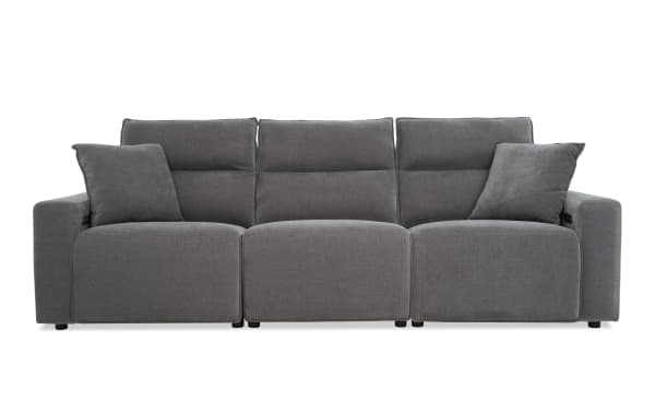 Modern gray fabric reclining sofa with three seats, high back cushions, and two matching throw pillows, ideal for living room comfort.