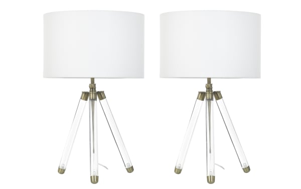 Pair of modern tripod table lamps with clear acrylic legs, antique brass accents, and white drum fabric shades, ideal for contemporary decor.