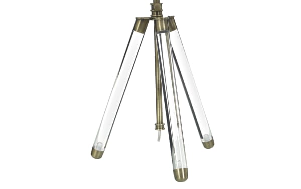 Tripod-style lamp base with three clear glass legs and antique brass metal caps and fittings, designed for modern home lighting.