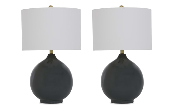 Set of two modern black ceramic table lamps with round bases and white drum fabric shades, ideal for living room or bedroom lighting.