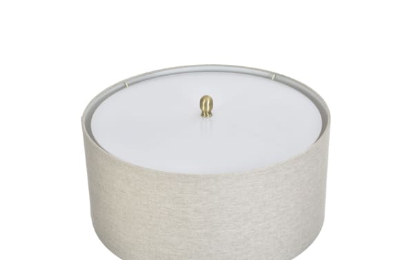 Round beige fabric drum lampshade with a white plastic diffuser and a small brass finial on top, suitable for modern table lamps.