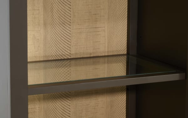 Glass shelf with metal frame and textured beige wood background, suitable for modern home or office storage and display.